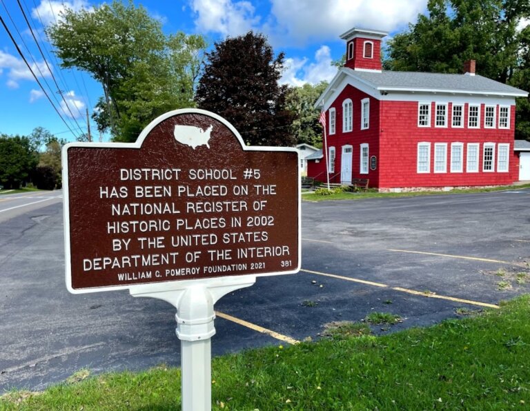 District School #5 National Register marker with view of school in the background.