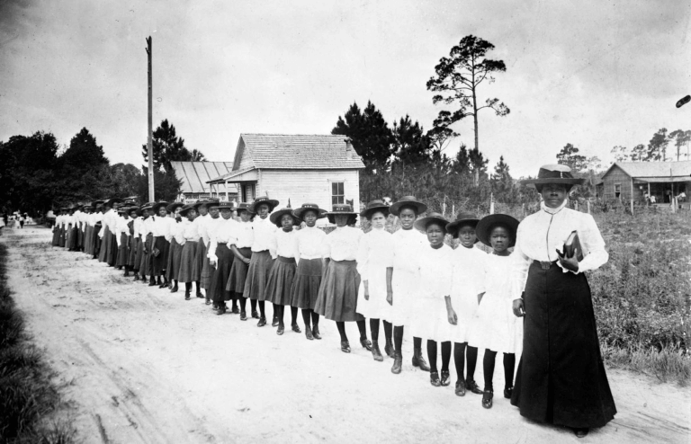 Mary McLeod Bethune with a line of girls from the School, 1905.