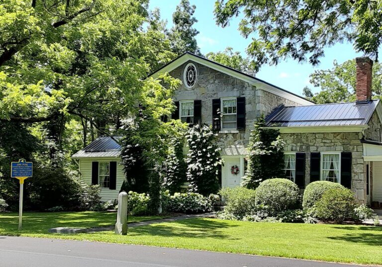 NYS marker for John Irving at historic home.