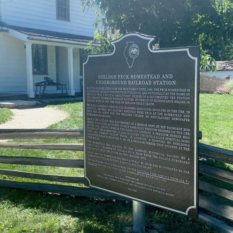 Illinois state historical marker at the Sheldon Peck homestead.
