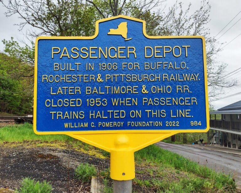 New York State historical marker for passenger depot. Marker funded by the William G. Pomeroy Foundation.