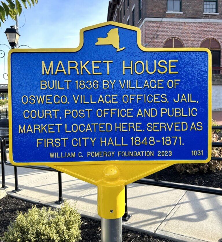 Historical marker for the Market House in Oswego, New York. Funded by the William G. Pomeroy Foundation.