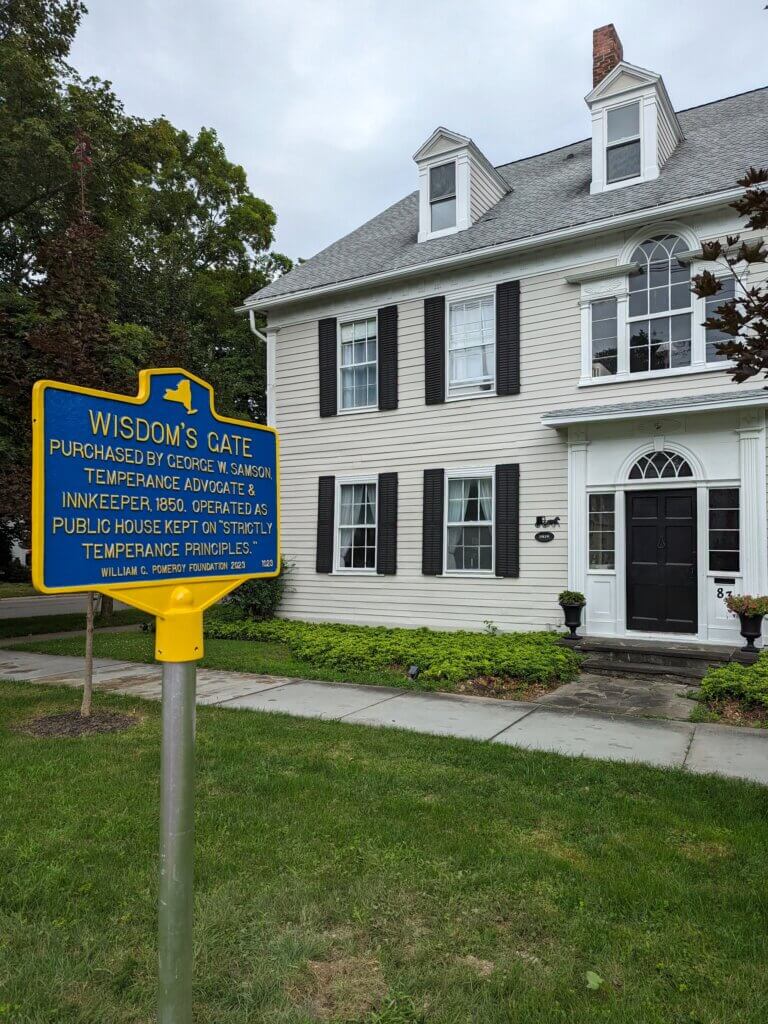 Historical marker funded by the William G. Pomeroy Foundation that commemorates Wisdom's Gate in Homer, New York.