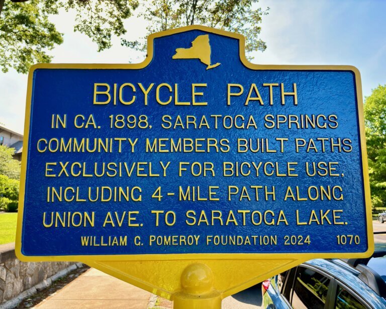 Close up view of the NYS historical marker for Bicycle Path, Saratoga Spring, New York.